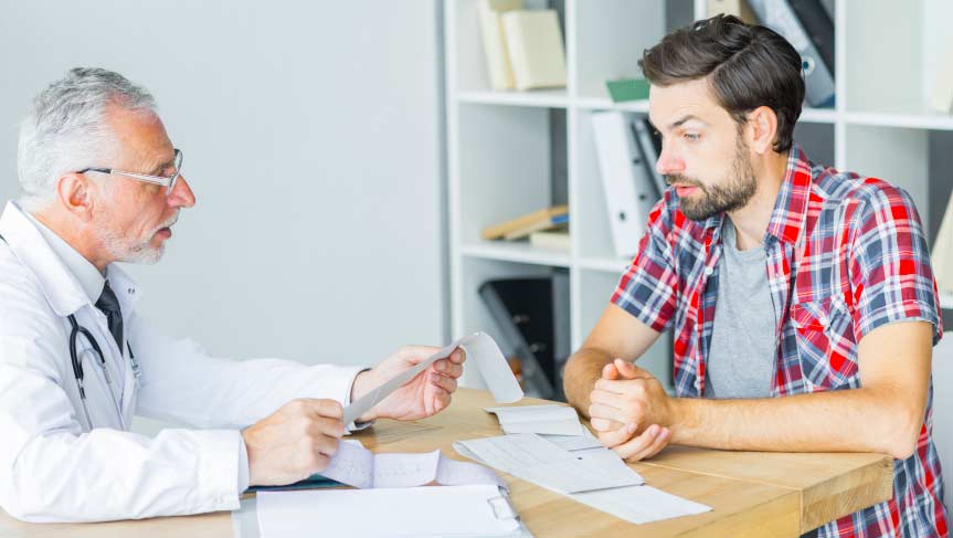 Immigrant patient talking to USCIS Civil Surgeon during medical exam consultation